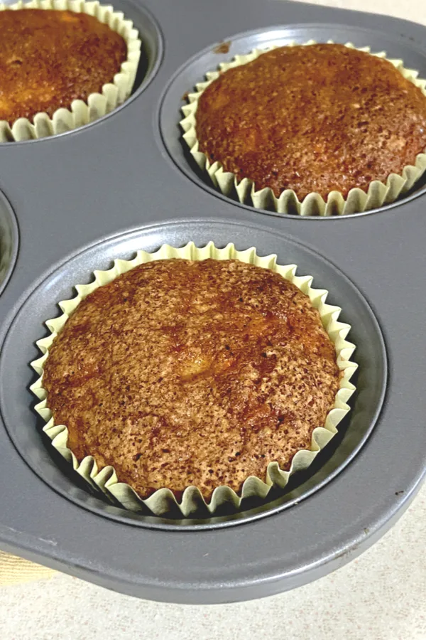carrot cake muffins baked but not topped with frosting