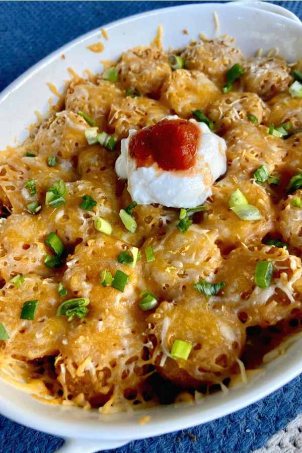 Mexican tater tot casserole with sour cream on top