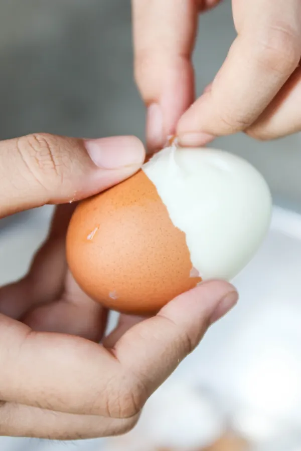 peeling a hard boiled egg