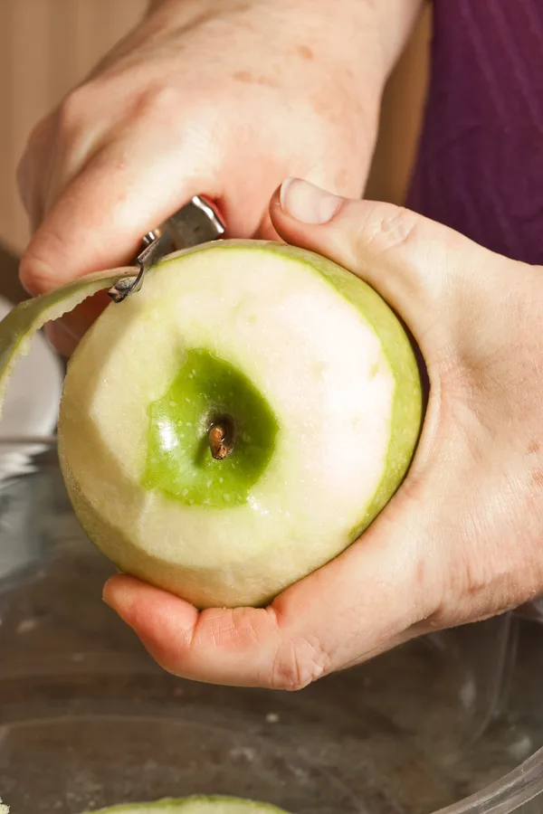 peeling Granny Smith apples 