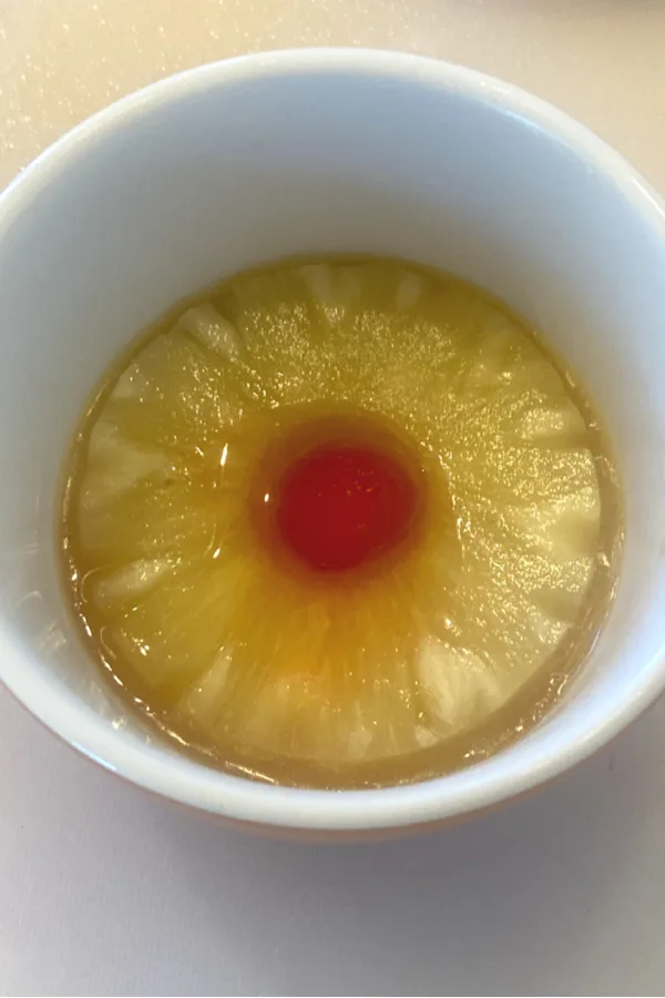 pineapple ring and cherry in the center 
