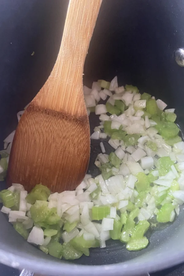 diced pepper and onions in bacon grease