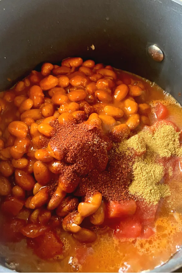chili beans and seasoning in a pot