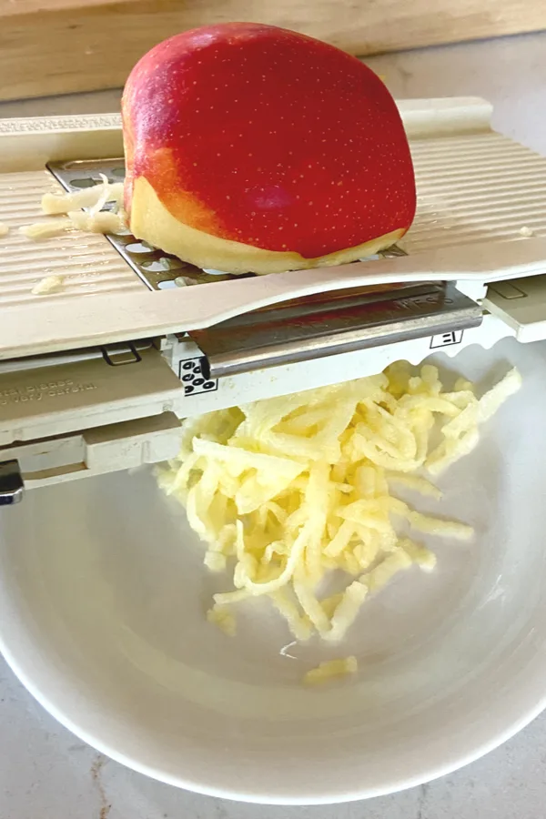 grating an apple 