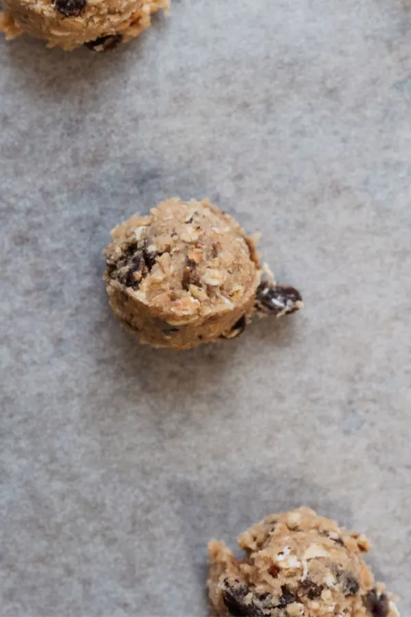 cookie dough balls on parchment paper