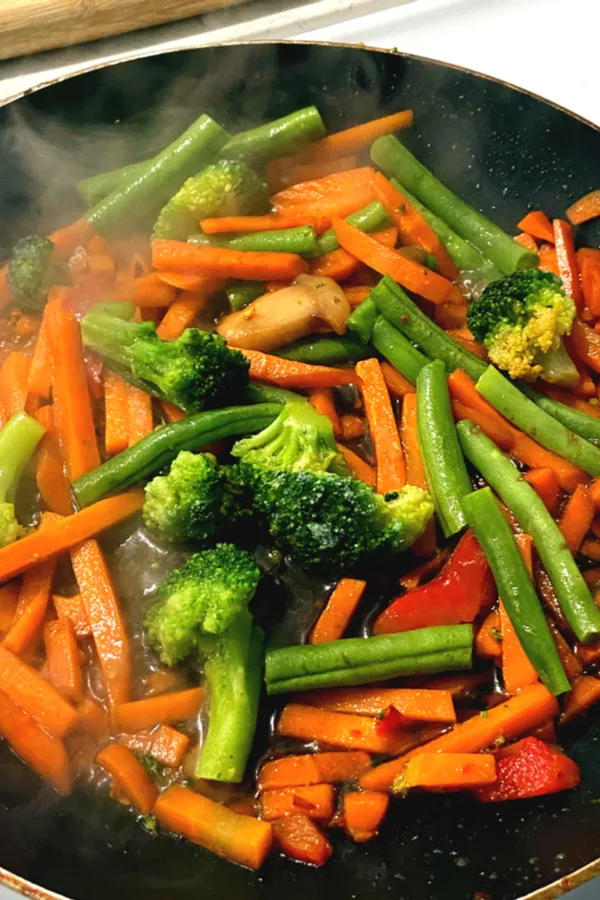 fresh vegetables in a skillet 