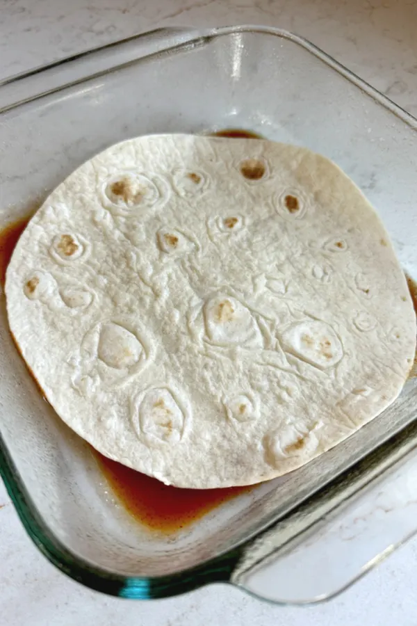 red sauce with tortilla on top