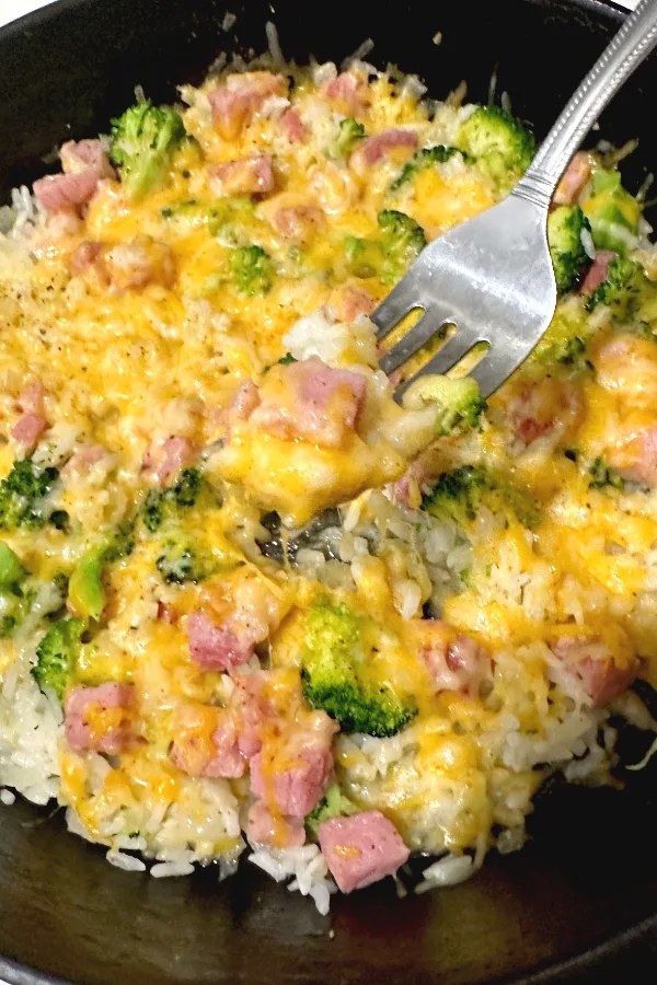 bite of cheesy ham and rice casserole
