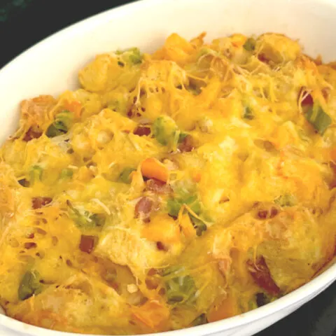 overnight breakfast casserole in a small oval baking dish