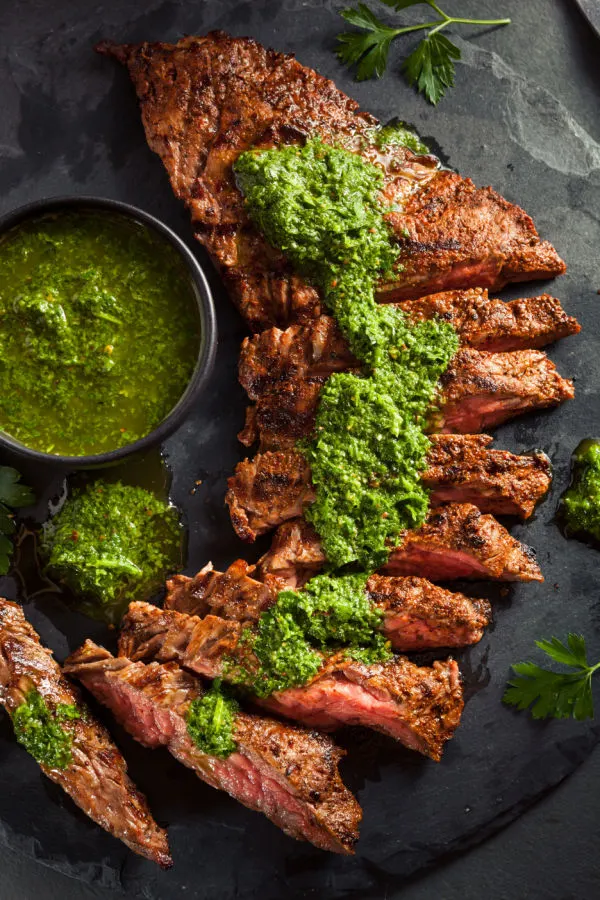 chimichurri sauce on sliced steak