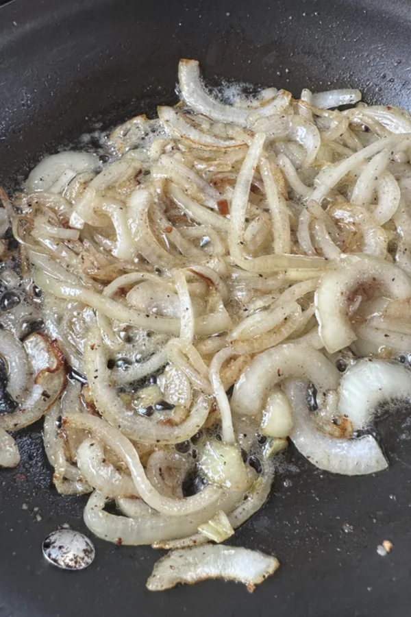 onions saut&eacute;ing in skillet