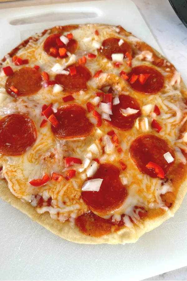 pizza on cutting board