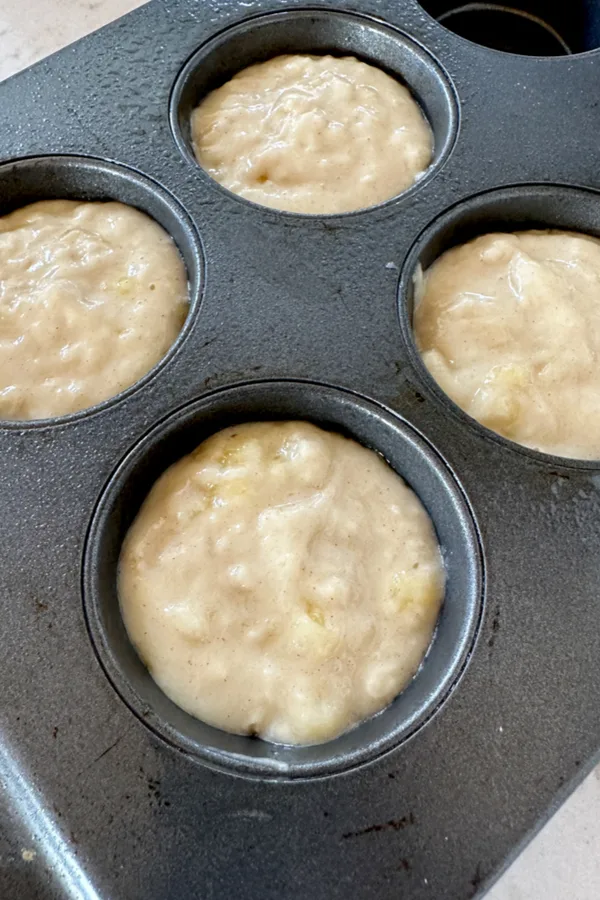 1 ripe banana muffin batter in muffin tin 