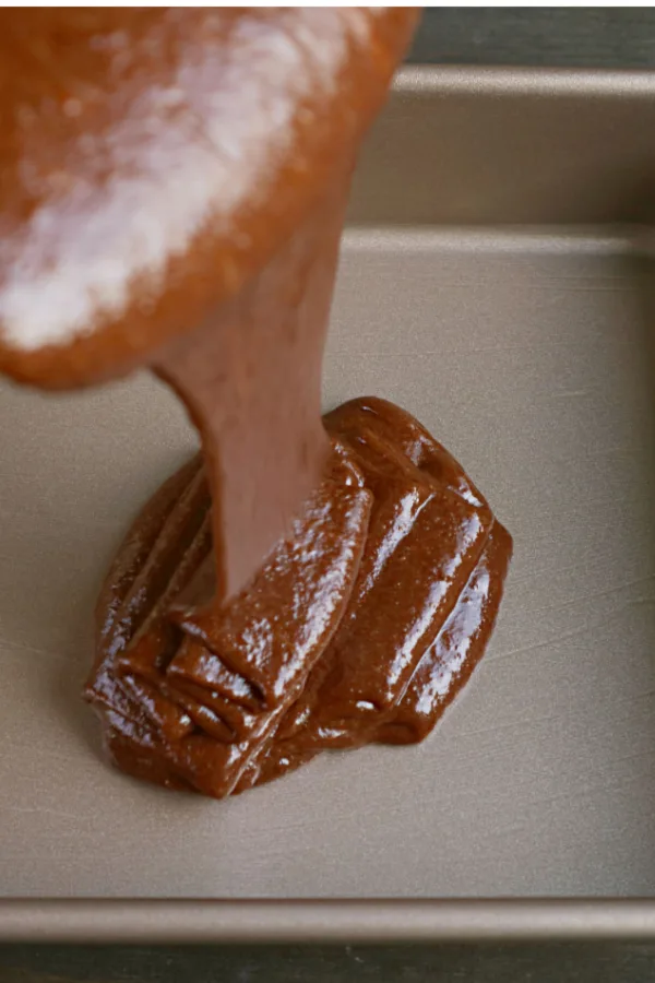 Texas sheet cake batter pouring in pan