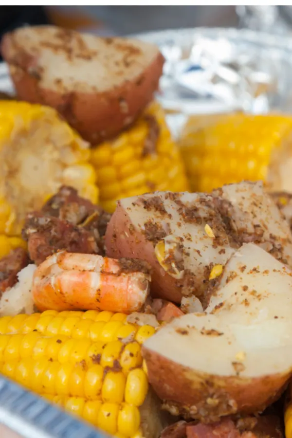 old bay seasoning sprinkled over top of a shrimp boil 
