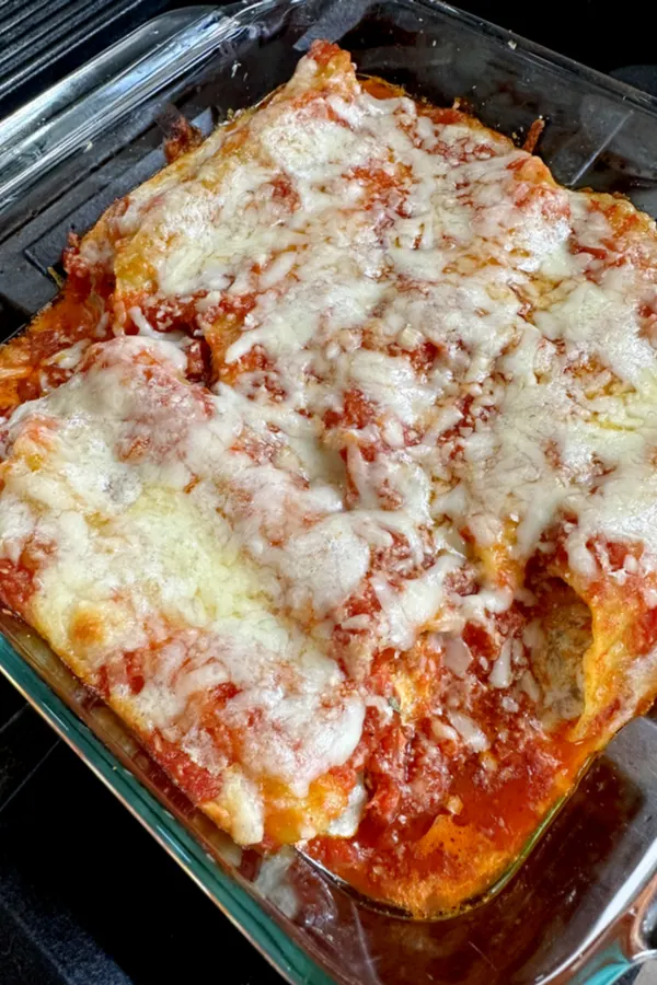 manicotti covered with marinara sauce and Mozzarella cheese 