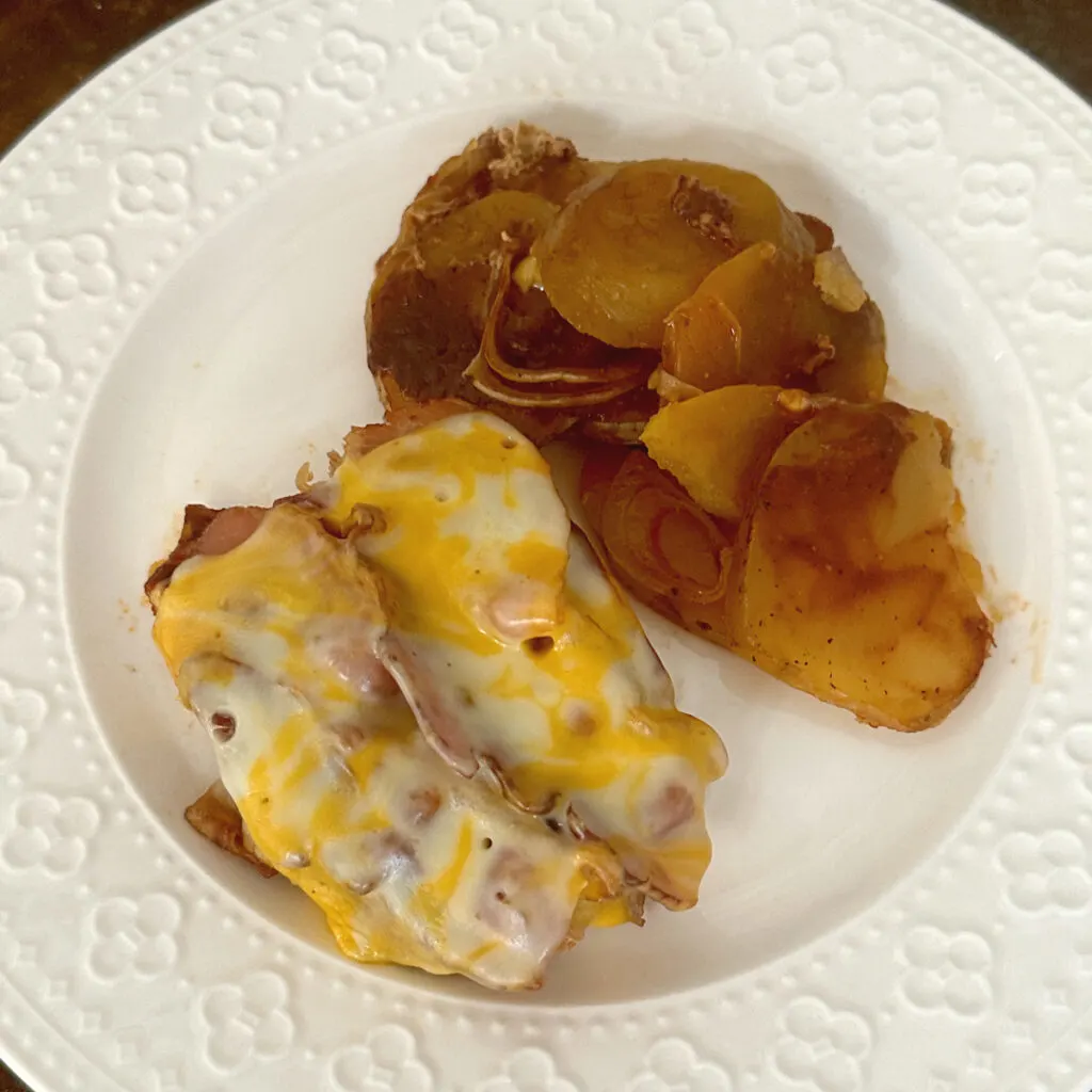 crock pot barbecue pork chops and potatoes on plate