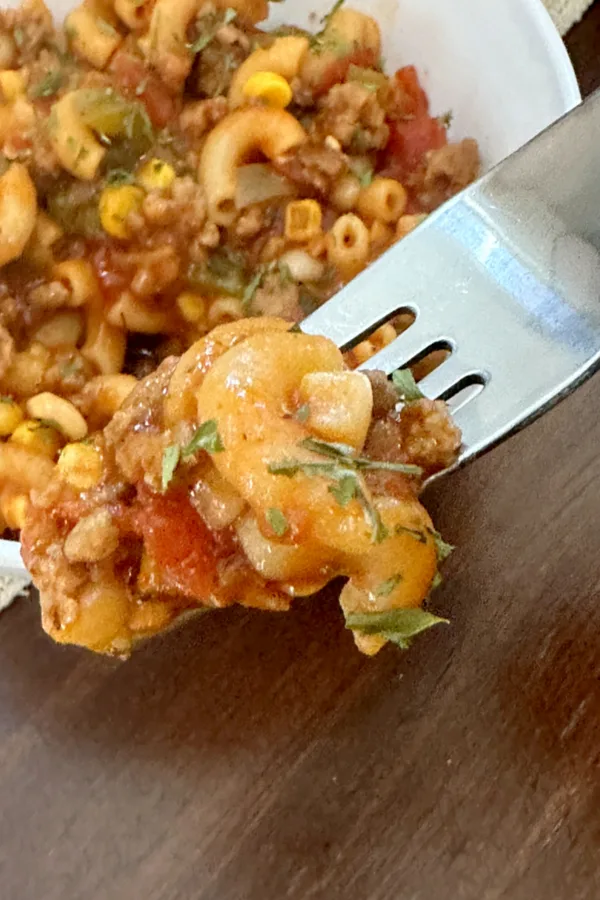 Elbow pasta, ground beef, tomatoes and corn.