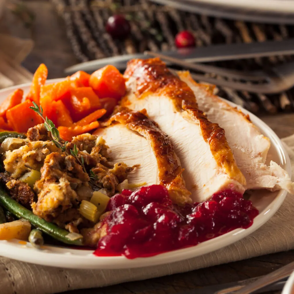 thanksgiving dinner on a plate made entirely on one sheet pan