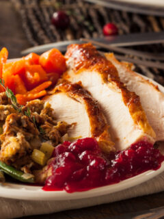 thanksgiving dinner on a plate made entirely on one sheet pan
