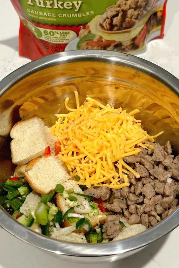 Christmas breakfast casserole ingredients in bowl