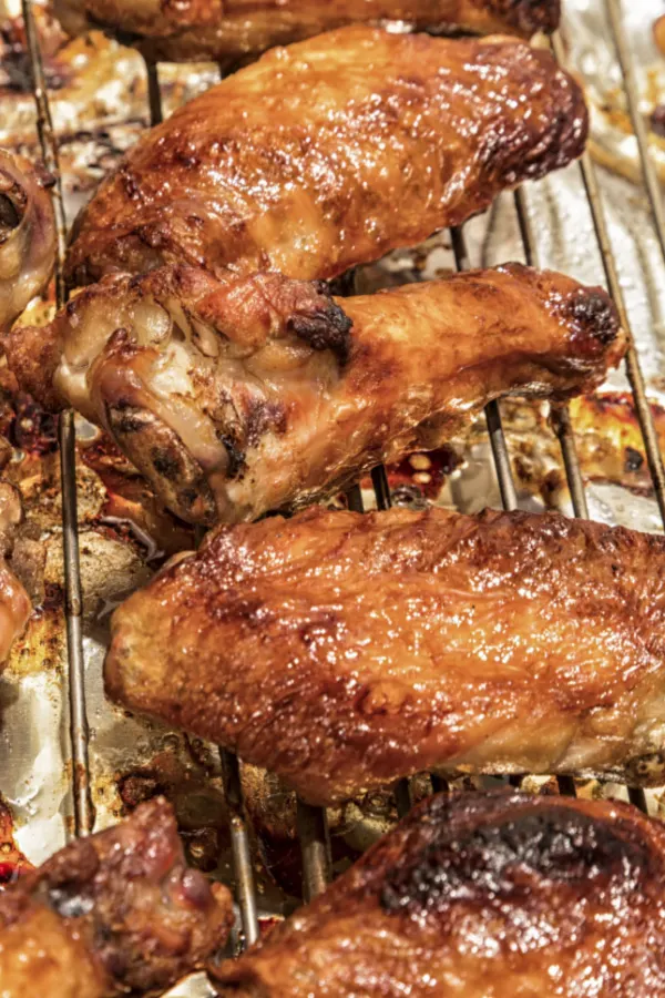 baking rack with chicken pieces baked
