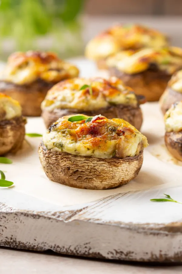 easy stuffed mushrooms on a serving board