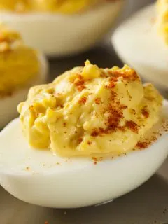 deviled egg with paprika sprinkled on top