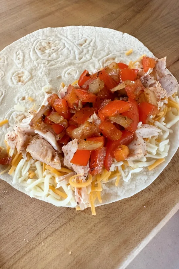 tortilla with meat and veggies on one side