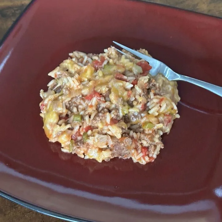 ground beef rice skillet dinner on red plate