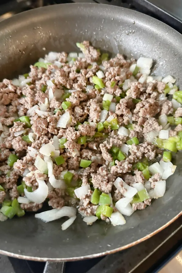 ground beef, onions, green pepper in skillet