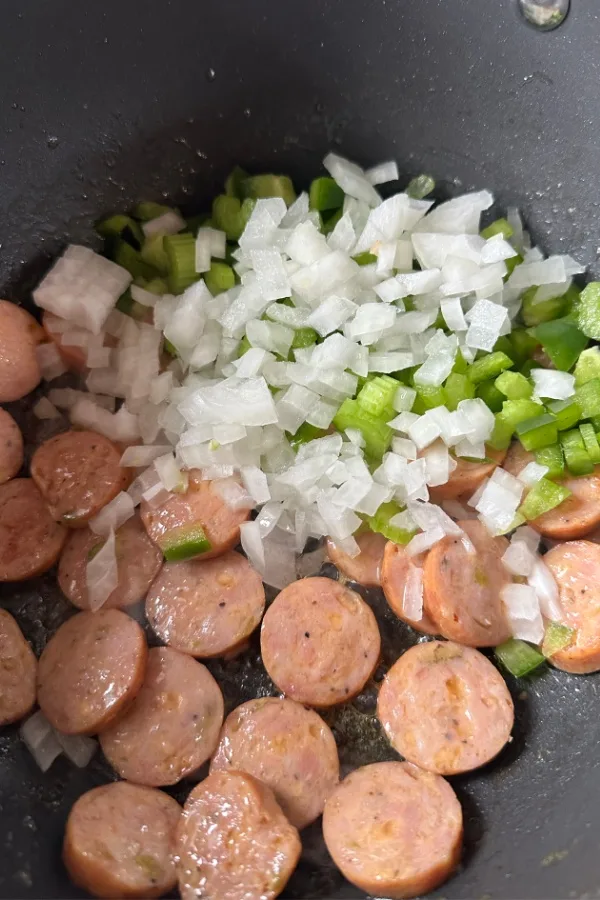 holy trinity of vegetables and sausage in skillet