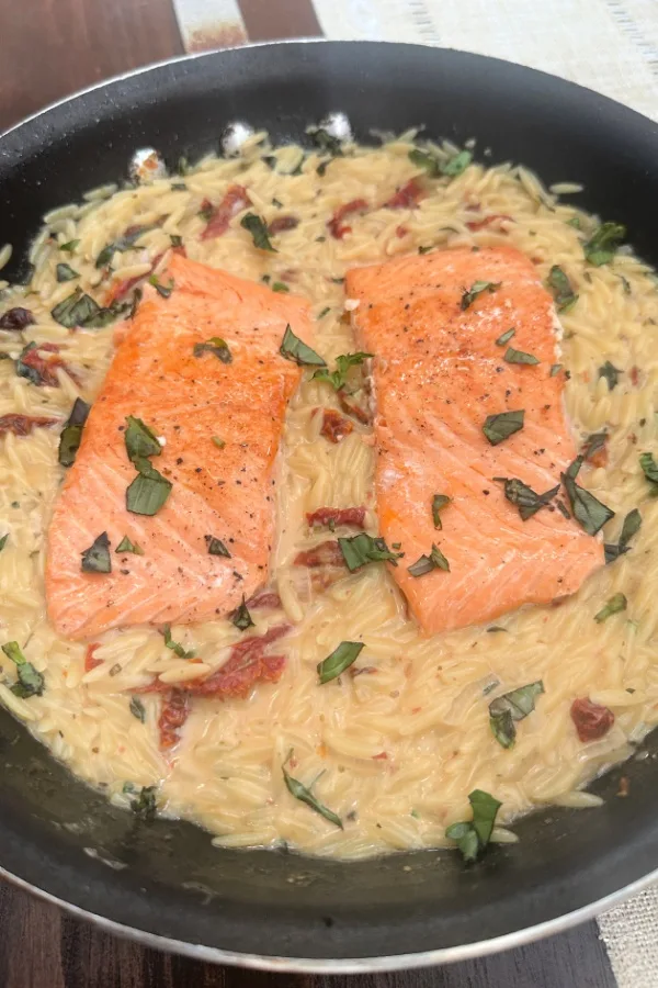 sun-dried tomato salmon and orzo in skillet