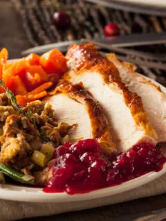 thanksgiving dinner on a plate made entirely on one sheet pan